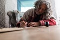 Elderly man doing calligraphy using a nib pen Royalty Free Stock Photo