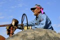 Elderly man drives tractor