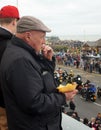 Elderly man eats chips