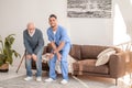 Elderly man exercising with an experienced physical therapist