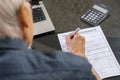 Elderly man filling health insurance form Royalty Free Stock Photo