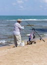 Elderly man fishing with a fishing rod