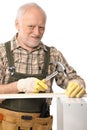 Elderly man hammering