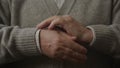 Elderly Man Hands Crossed in Lock Close Up