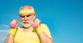 Elderly man after her workout. Health club or rehabilitation center for elderly aged pensioner. Senior sport man lifting Royalty Free Stock Photo