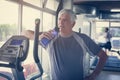 The elderly man holding a bottle of water. Royalty Free Stock Photo