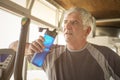 The elderly man holding a bottle of water. The man is refreshed Royalty Free Stock Photo