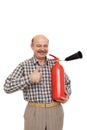 Elderly man is holding a red fire extinguisher. Royalty Free Stock Photo