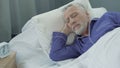 Elderly man lacks in strength and energy to wake up from bed early in morning