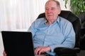 Elderly man on laptop Royalty Free Stock Photo