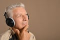 Elderly man listen to music in headphones