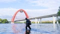 an elderly man in long boots fishing on the river- Moscow, Silver Forest in Moscow