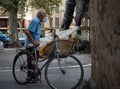 Elderly man with an old bicycle with a shopping basket from the market, Palma, Spain