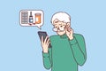 Elderly man orders medicines for home delivery using mobile phone from pharmacy application