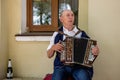 An elderly man playing the russian accordion. Suzdal, Russia