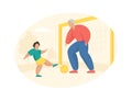 Elderly man plays football with boy. Grandfather stands at goal and hits ball his grandson Royalty Free Stock Photo