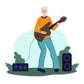 An elderly man plays guitar in a Park