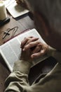 Elderly man is reading a bible Royalty Free Stock Photo