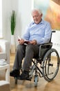 Elderly man reading book at home Royalty Free Stock Photo