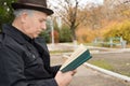 Elderly man reading and enjoying the peace Royalty Free Stock Photo