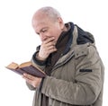 Elderly man reading holy bible Royalty Free Stock Photo