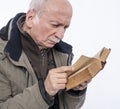 Elderly man reading holy bible Royalty Free Stock Photo