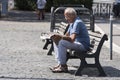 Elderly man reading newspaper