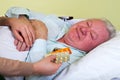 Elderly man receiving medication Royalty Free Stock Photo