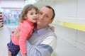 Elderly man in shop with child