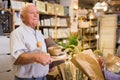 Elderly man at shopping at household store Royalty Free Stock Photo