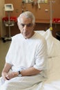 Elderly Man Sitting On Hospital Bed Royalty Free Stock Photo