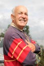 An elderly man smiling in the sun Royalty Free Stock Photo