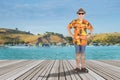 Elderly man standing on the dock bridge