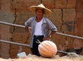 Elderly man in a straw hat, typical representative of the ethnic Hakka