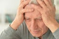 Elderly man suffering from a headache at home Royalty Free Stock Photo