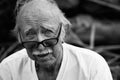 Elderly man in t-shirt and glasses