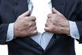 Elderly man tearing a shirt and a suit on his chest isolated on white Royalty Free Stock Photo