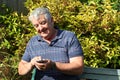 Elderly man texting on his mobile phone. Royalty Free Stock Photo