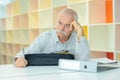 Elderly man with thoughful face indoors