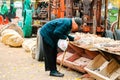 An elderly man tries to buy the stones in a Moab store while it