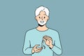 Elderly man uses glucometer to measure level insulin in blood, rejoicing at easing of diabetes. Royalty Free Stock Photo