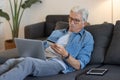 Elderly man using credit card for online shopping Royalty Free Stock Photo