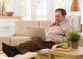 Elderly man using laptop computer Royalty Free Stock Photo