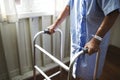 An elderly man using a walker Royalty Free Stock Photo