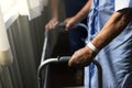 An elderly man using a walker Royalty Free Stock Photo