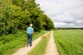 Elderly man is walking the dog Royalty Free Stock Photo