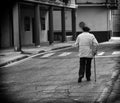 Elderly man walking street