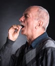 Elderly man wants to take a pill Royalty Free Stock Photo