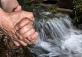 Elderly man washes his hands