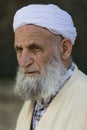 Elderly man wearing a turban.